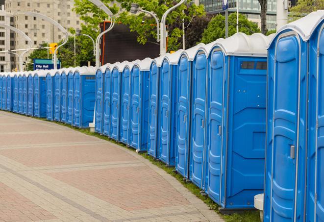 hygienic portable restrooms lined up at a beach party, ensuring guests have access to the necessary facilities while enjoying the sun and sand in Jersey Village